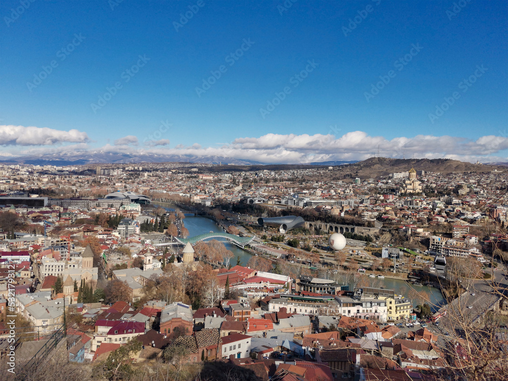 Panoramic view of Tbilisi. Capital of Georgia on sunny day aerial view. Old town with building and river