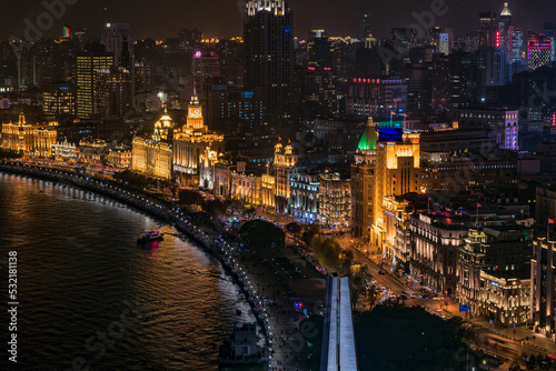 Panoramic view of historical buildings at the Bund, Shanghai at night. photo