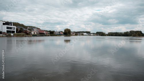 Lake in Berlare, Belgium, on a cloudy summer day © Catalin