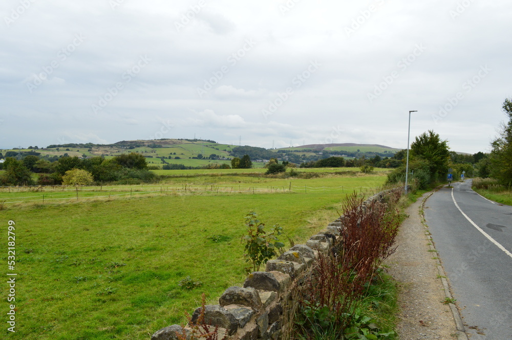 Rural Country Road with View of Hills, Road and Wall