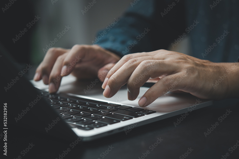 Businessman working laptop computer hand typing keyboard computer office technology communication internet on desk. Businessman working laptop computer hand typing keyboard computer office technology communication internet on desk.