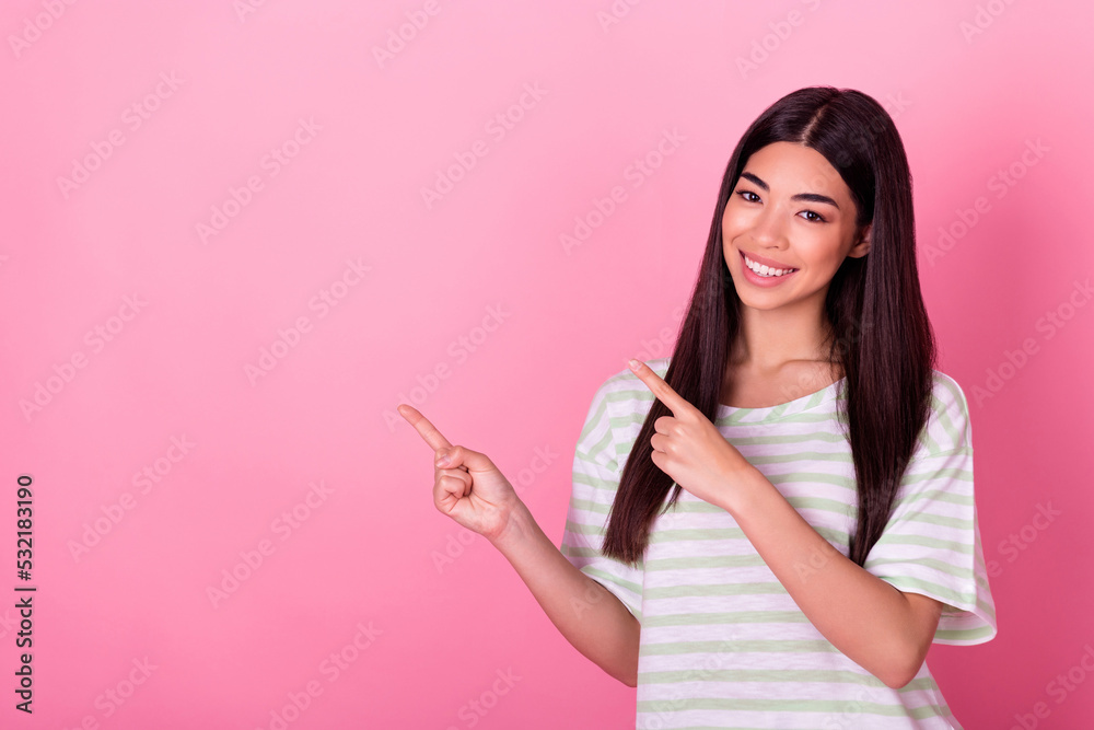 Photo of positive lady point finger empty space indicate promotion object empty space isolated pastel color background Photo of positive lady point finger empty space indicate promotion object empty space isolated pastel color background