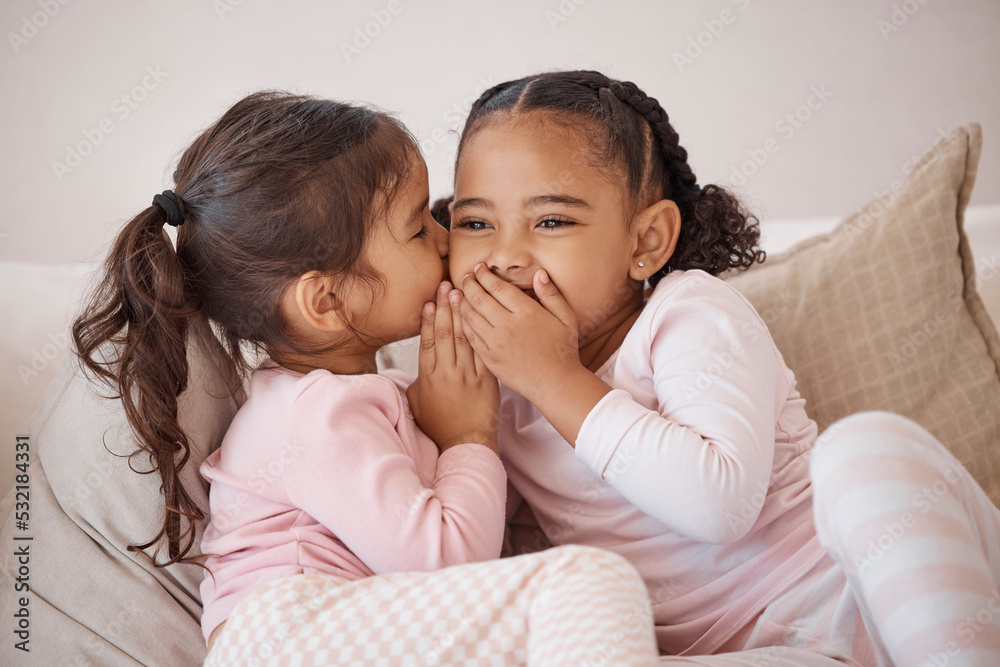 Girl, friends or children whisper secret to best friend on home sofa while relax together on play date. Communication, conversation and sisters or youth kids gossip at fun slumber party or sleepover Girl, friends or children whisper secret to best friend on home sofa while relax together on play date. Communication, conversation and sisters or youth kids gossip at fun slumber party or sleepover