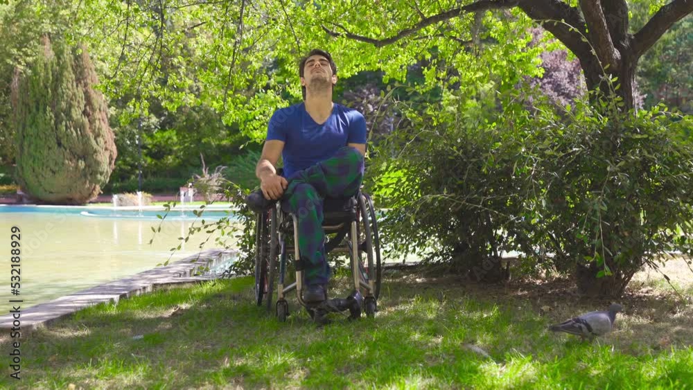 Disabled man in wheelchair resting in nature.
Disabled young man in a wheelchair is resting under a tree.
Disabled man in wheelchair resting in nature.
Disabled young man in a wheelchair is resting under a tree.