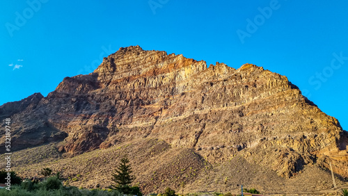 Scenic view on the massive sharp cliffs and mountain Cueva de Cabras in the La Mercia mountain range in Valle Gran Rey, La Gomera, Canary Islands, Spain, Europe. Summit in the Garajonay national park