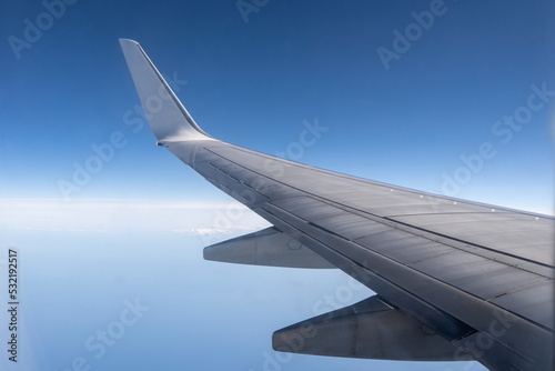 View from the inside or interior of the airplane. Airplane porthole window view from the passenger seat