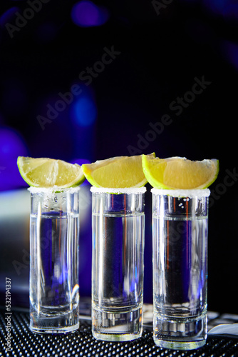Tequila with lime on the bar of a nightclub