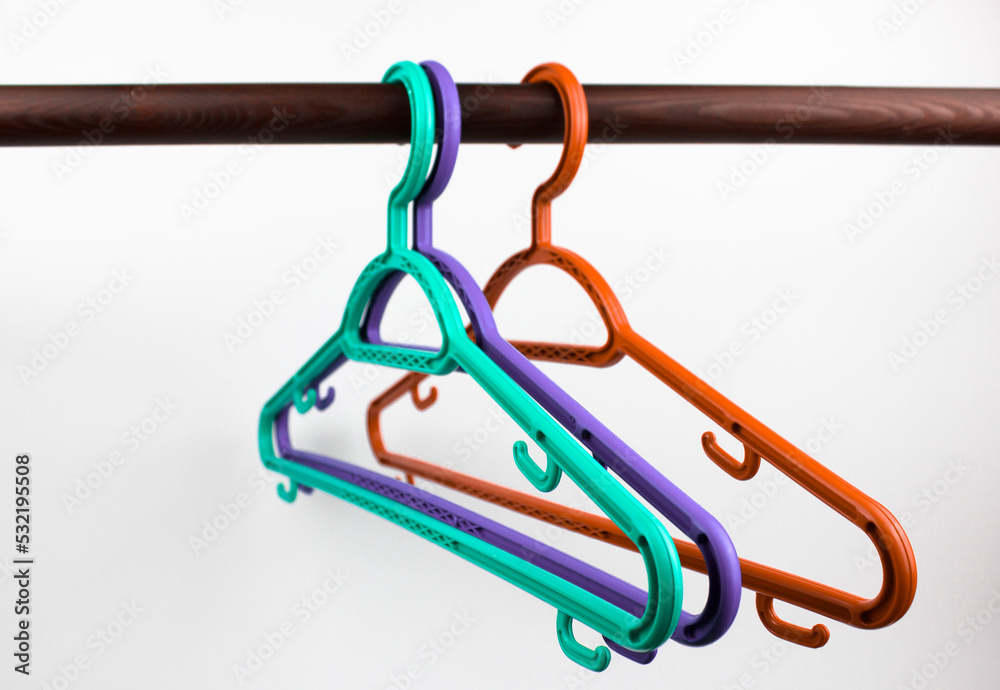 Plastic hangers in insulated closet.Single hangers, retail, hangers without clothes. Plastic hangers in insulated closet.Single hangers, retail, hangers without clothes.
