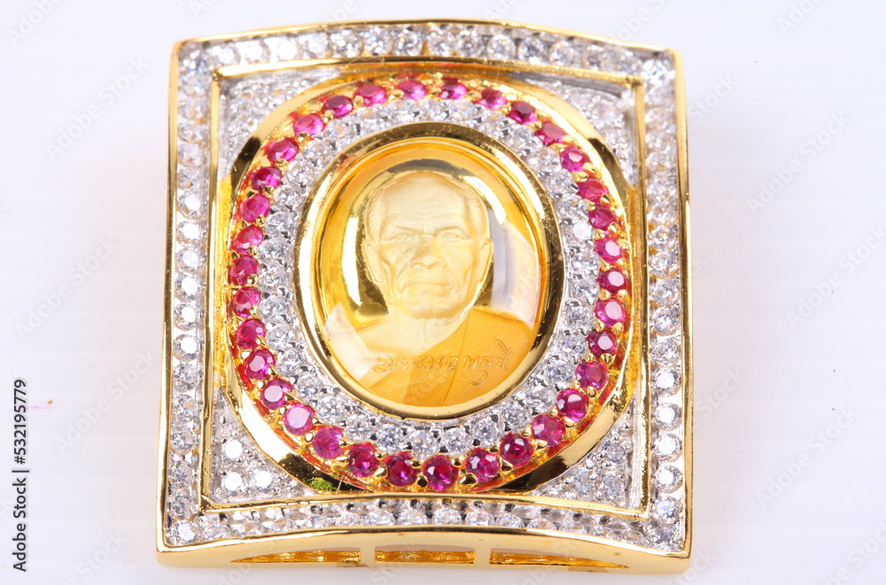 Obraz premium Golden Buddha Pendant Jewel on white Background
