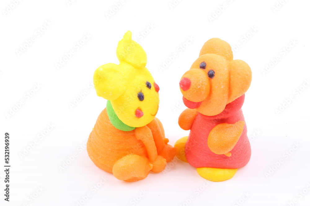 Doll made of colored sugar isolated on white Doll made of colored sugar isolated on white