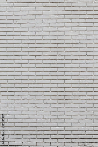 Background image vertical striped brick wall painted white, visible fine textures.