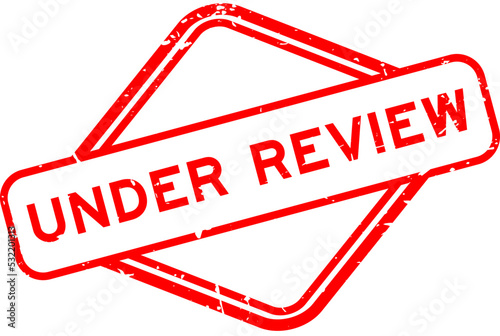 Grunge red under review word rubber seal stamp on white background