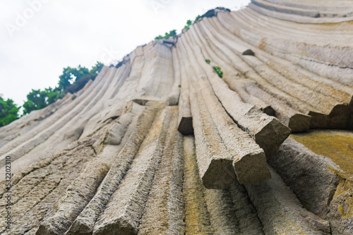 basalt columns forming a coastal rock at Cape Stolbchaty on Kunashir Island  close-up