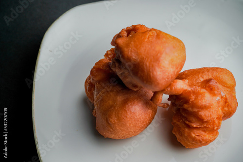 Orang-orang cake is a typical snack from Indonesia. Made from a mixture of wheat flour and bananas, then fried. photo
