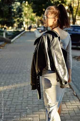 woman walking in the street © Victoria