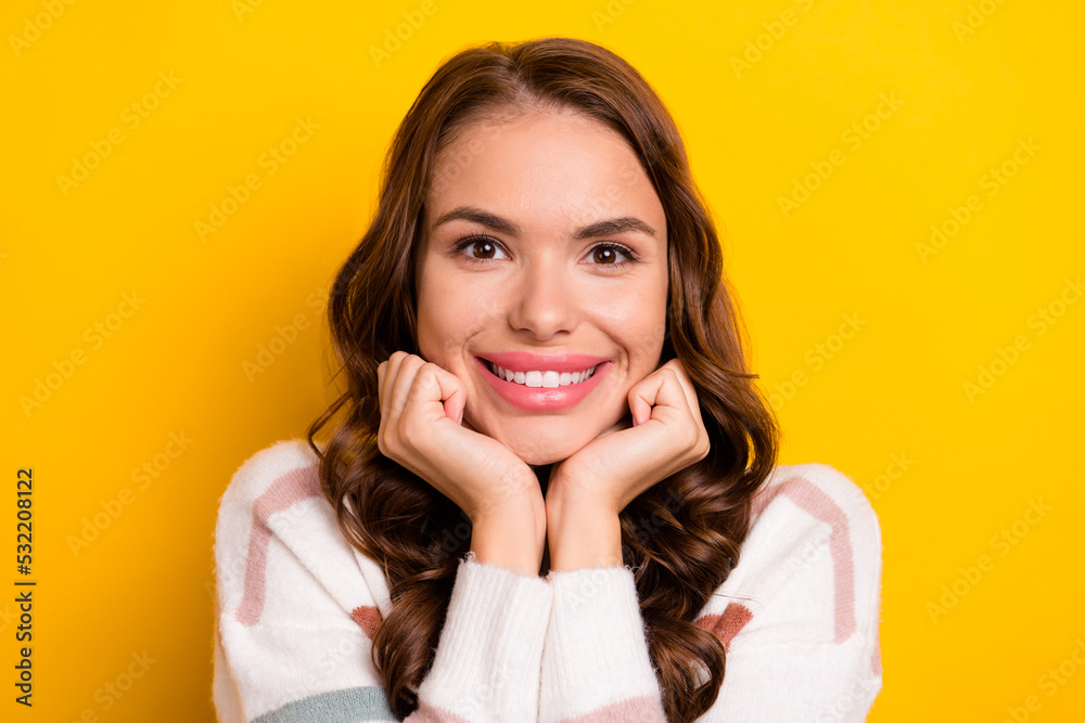 Photo of stunning satisfied person arms touch cheeks beaming smile isolated on yellow color background Photo of stunning satisfied person arms touch cheeks beaming smile isolated on yellow color background