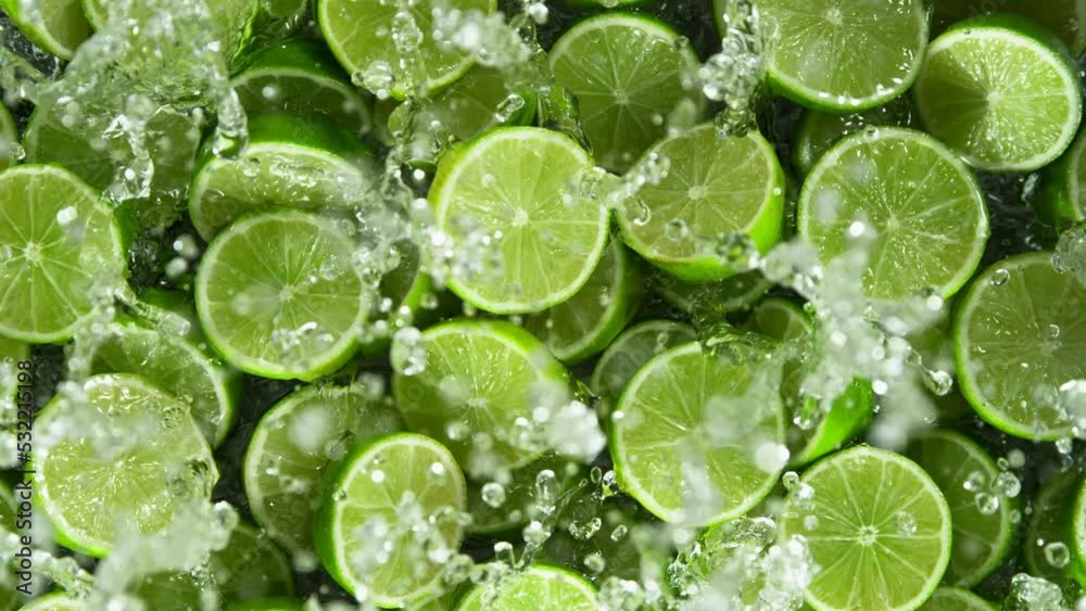 Super Slow Motion Shot of Splashing Fresh Limes. Filmed on High Speed Cinematic Camera at 1000fps. Super Slow Motion Shot of Splashing Fresh Limes. Filmed on High Speed Cinematic Camera at 1000fps.