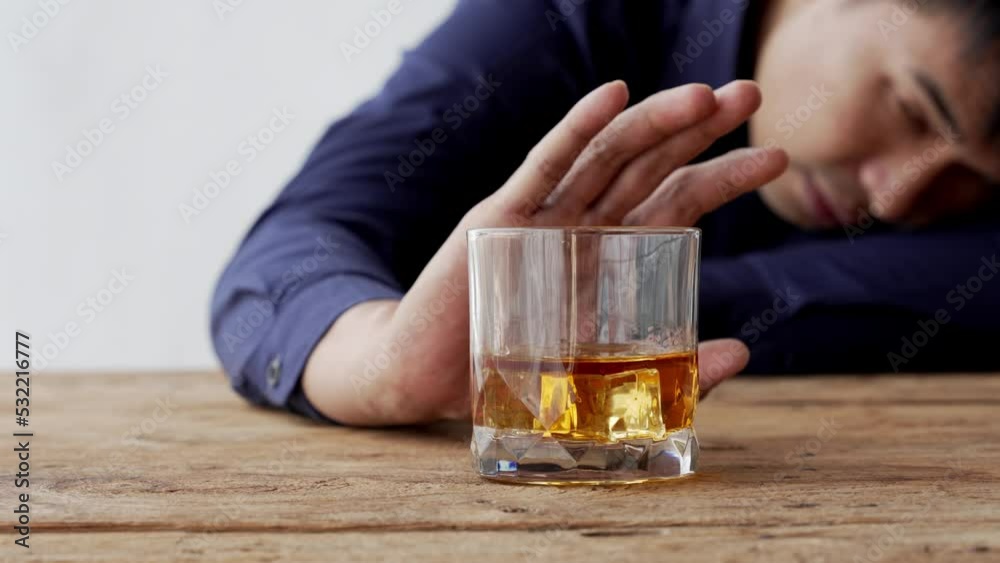 Alcoholism concept. Young man drinking alcohol too much. drunk asian man hold whisky glass addicted alcohol need therapy. Alcoholism concept. Young man drinking alcohol too much. drunk asian man hold whisky glass addicted alcohol need therapy.