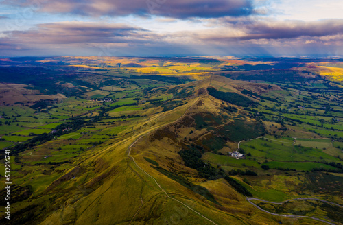 Panorama of welsh countryside. British landscape. Aerial panoramic view of typical british farmers fields and some sheep. England UK. Scenic British Countryside at Summer. 