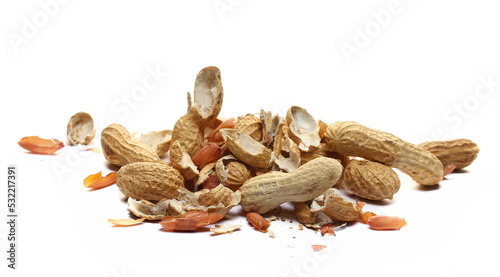 Shelled and unshelled peanuts pile isolated on white
