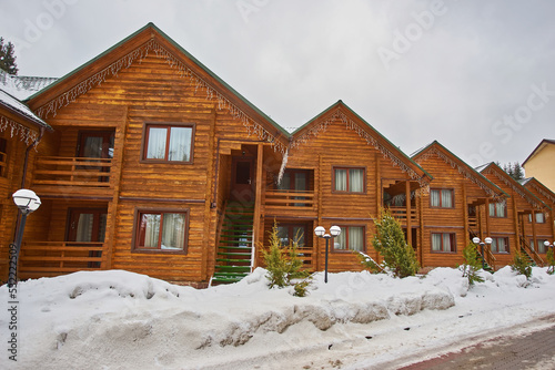 wonderful winter scenery with snow and timber home