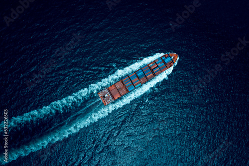 Wallpaper Mural container ship to import export marine goods to dealers and consumers across the pacific and around the world, businesses and industries Ocean freight forwarding, processing blue tone cinematic Torontodigital.ca