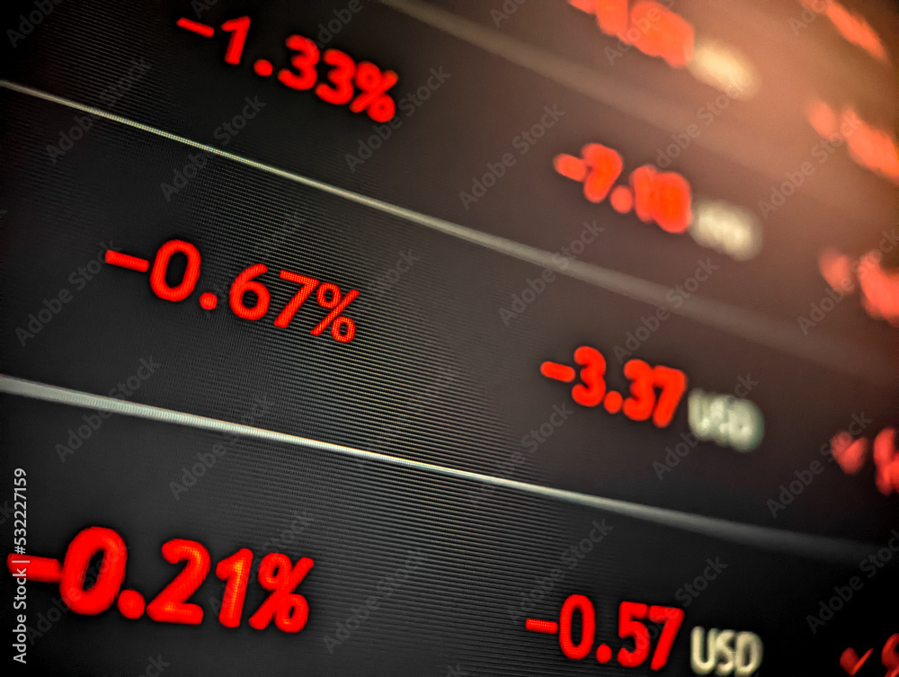 Stock market cryptocurrency price chart with red numbers displayed on a pixelated monitor with dark background