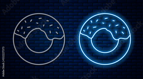 Glowing neon line Donut with sweet glaze icon isolated on brick wall background. Vector