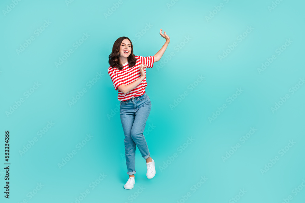 Full length photo of overjoyed nice lady rejoice holiday weekend empty space wear striped trendy outfit isolated on cyan color background