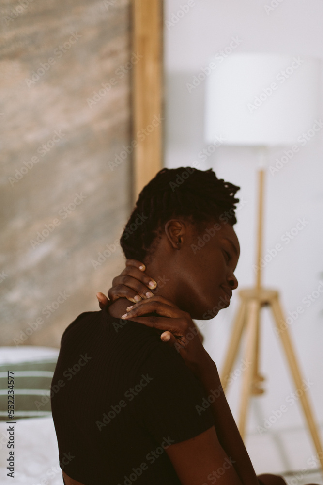 Beautiful afro american woman stretching neck muscles back view closeup ...