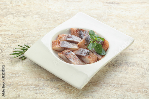 Delicous sliced herring fillet in grape sauce
