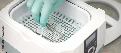 Hand disinfects tweezers with cleaning systems for medical instruments. Ultrasonic cleaner