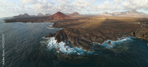 cliffs and red mountain from aerial view