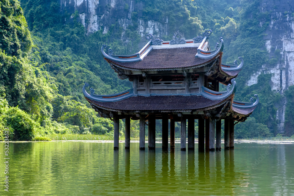 The ancient pagoda is located on the river in Trang An, Ninh Binh province, Vietnam. The ancient pagoda is located on the river in Trang An, Ninh Binh province, Vietnam.