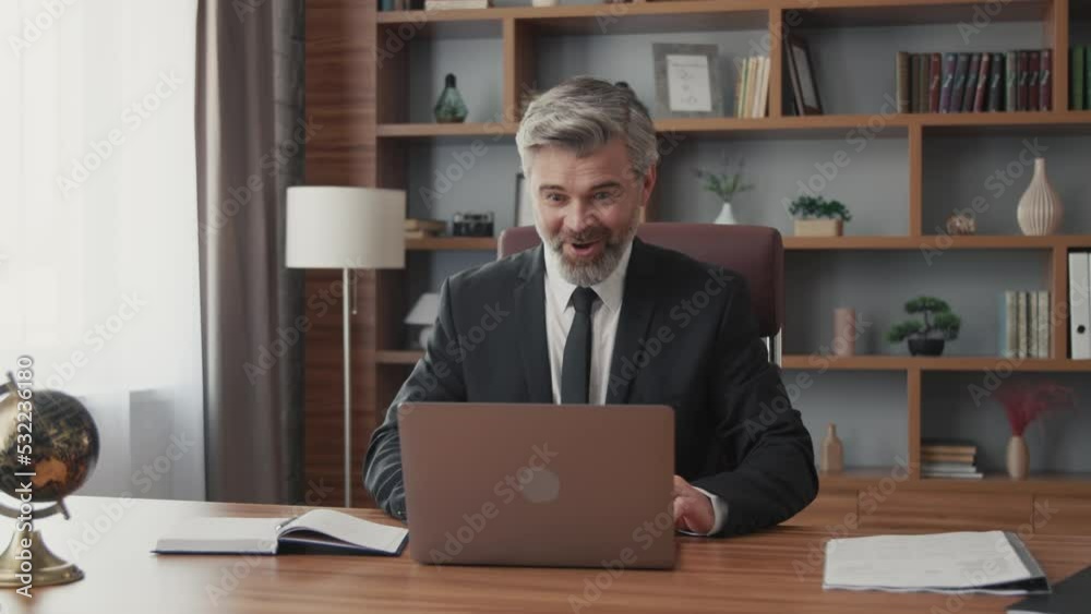 Excited gray-haired middle-aged businessman celebrating corporate success, enjoying victory and crazy profit for company Excited gray-haired middle-aged businessman celebrating corporate success, enjoying victory and crazy profit for company