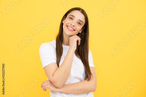 Happy smiling woman portrait. Attractive young pretty cheerful girl in casual clothing feeling happy and carefree, isolated background.