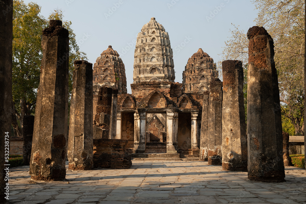 Access area to the Wat Si Sawai temple and pagodas of Thai style architecture, in Sukhothai Historical Park at sunset