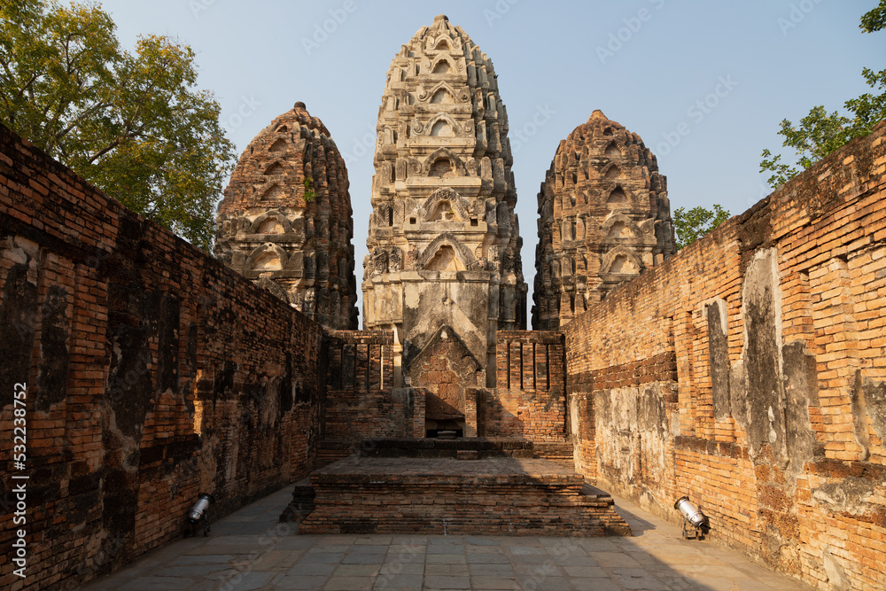 Wat Si Sawai temple and pagodas of Thai style architecture, in Sukhothai Historical Park at sunset