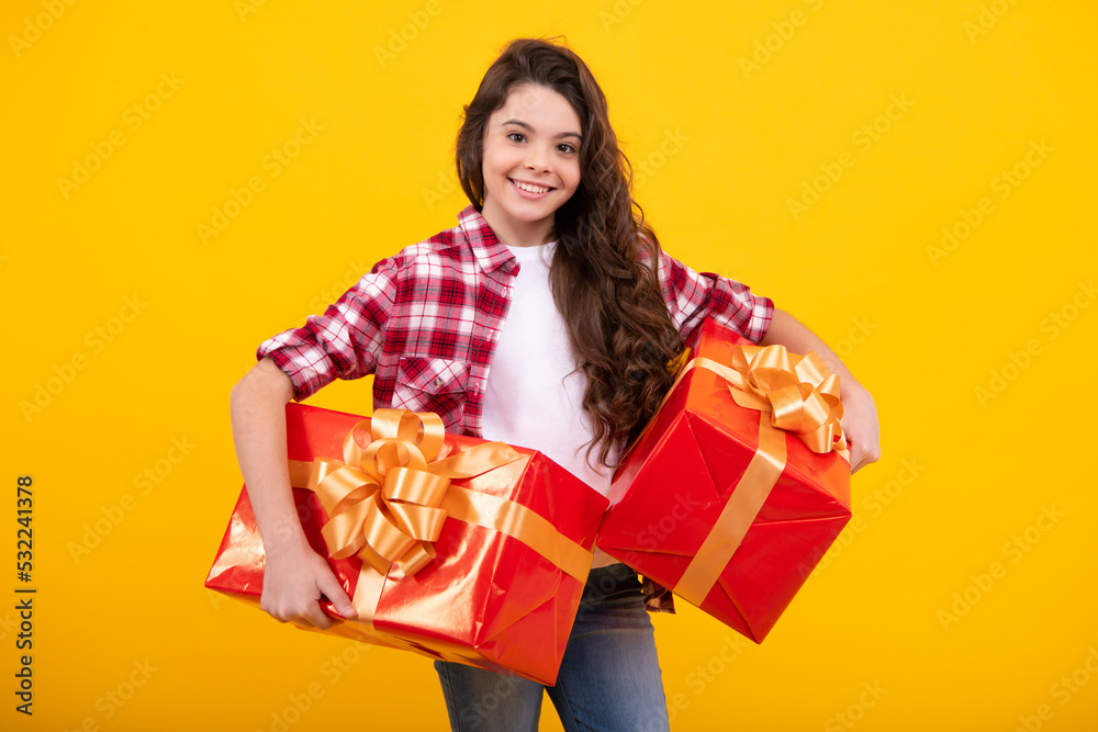 Teenager child with gift box. Present for holidays. Happy birthday, Valentines day, New Year or Christmas. Kid hold present box. Happy teenage girl, positive and smiling emotions. Teenager child with gift box. Present for holidays. Happy birthday, Valentines day, New Year or Christmas. Kid hold present box. Happy teenage girl, positive and smiling emotions.