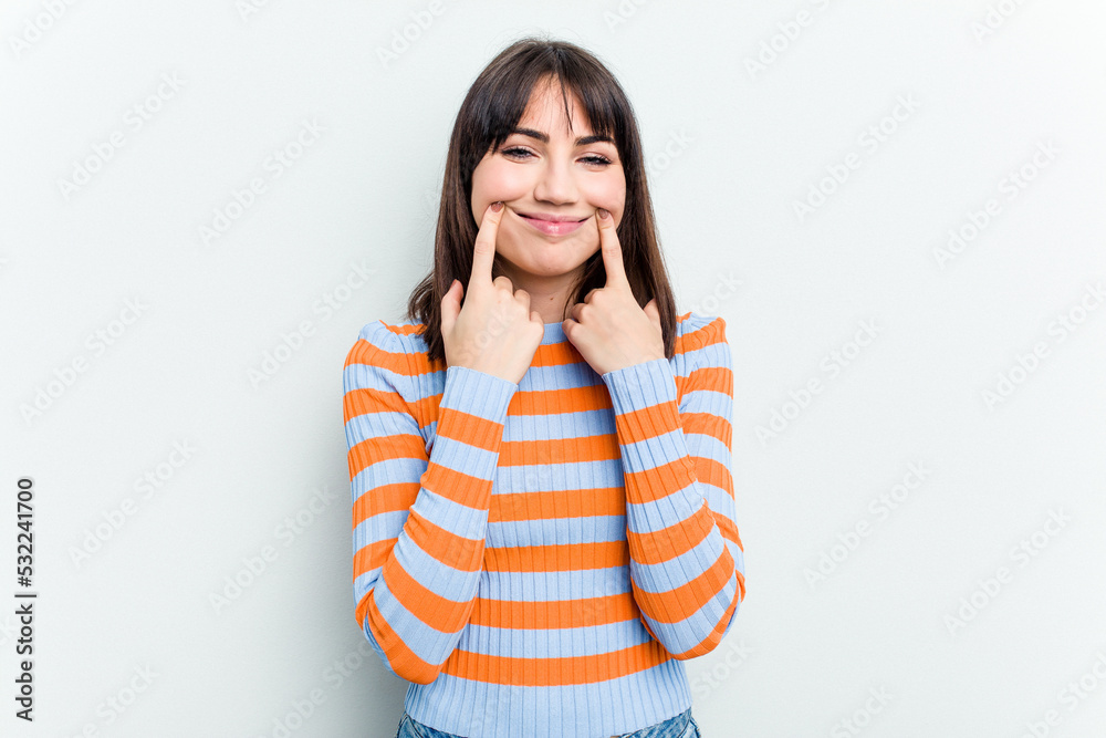 Young caucasian woman isolated on white background doubting between two options. Young caucasian woman isolated on white background doubting between two options.