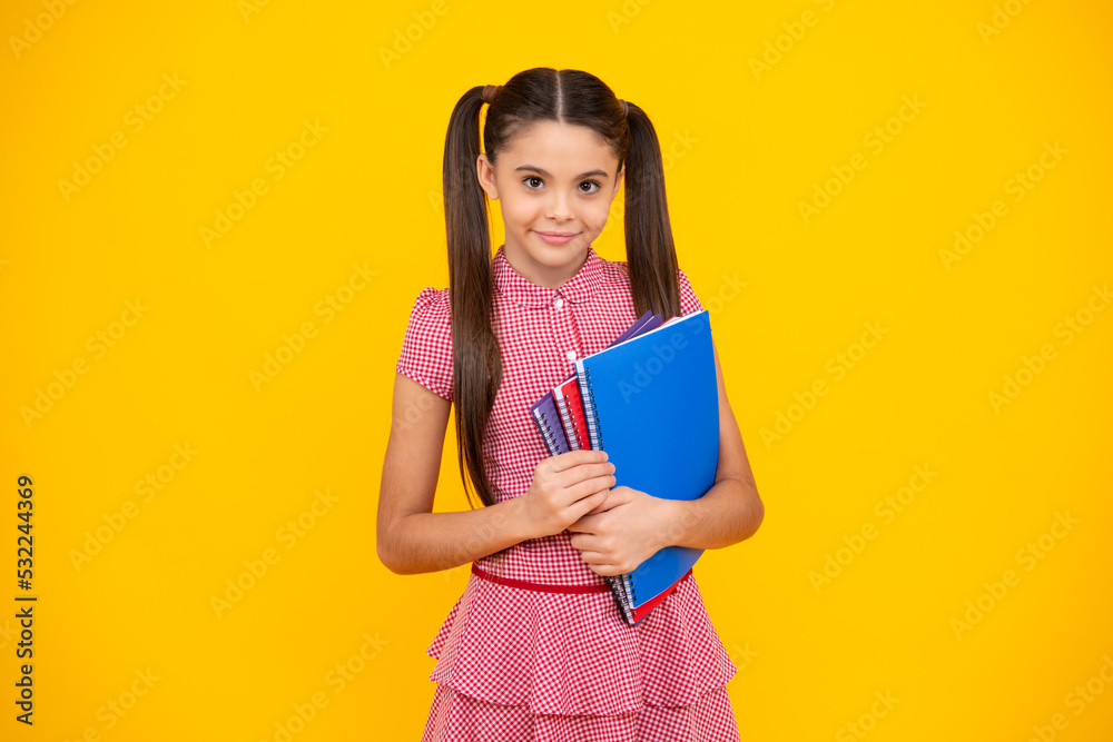 School child with book. Learning and education. Happy teenager, positive and smiling emotions of teen schoolgirl. School child with book. Learning and education. Happy teenager, positive and smiling emotions of teen schoolgirl.