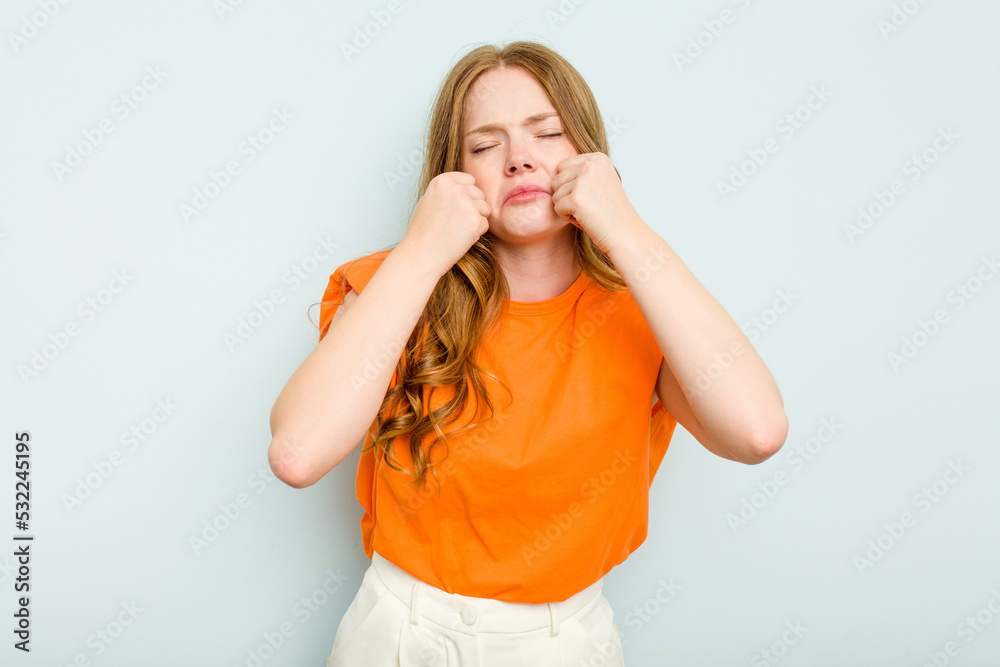 Young caucasian woman isolated on blue background whining and crying disconsolately. Young caucasian woman isolated on blue background whining and crying disconsolately.