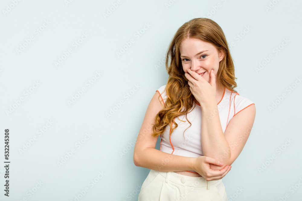 Young caucasian woman isolated on blue background laughing happy, carefree, natural emotion. Young caucasian woman isolated on blue background laughing happy, carefree, natural emotion.