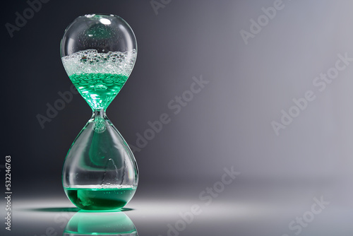 Hourglass With Water isolated on the gray background.