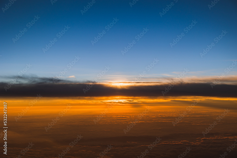 Sunset view from an airplane passenger seat