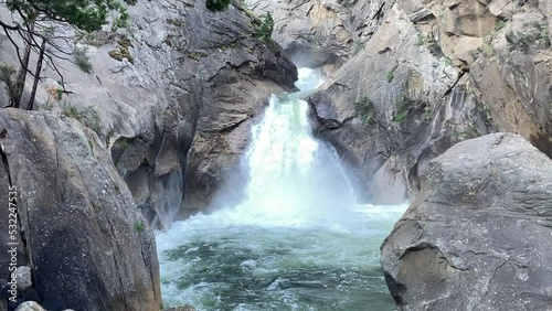 Roaring River Falls in full Spring flow, surrounded by huge granite boulders - Kings Canyon National Park, California, USA