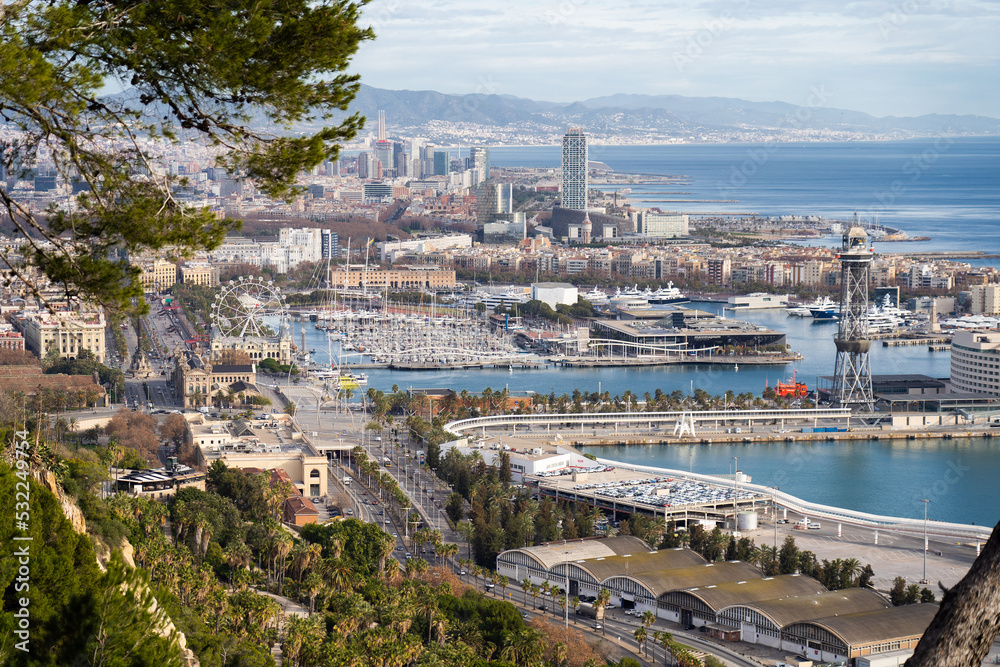 View of Barcelona city and sea shore with mountains on background. Vacation and travel concept