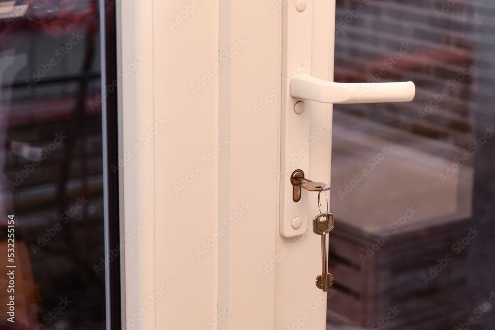 The keys to the front door in the door lock. The keys to the front door in the door lock.