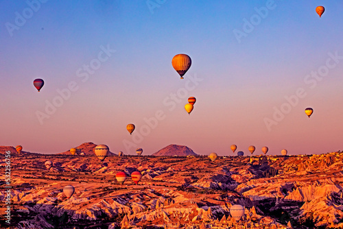 flight of hot air balloons in the circumference of Cappadocia, top view, horizontal.