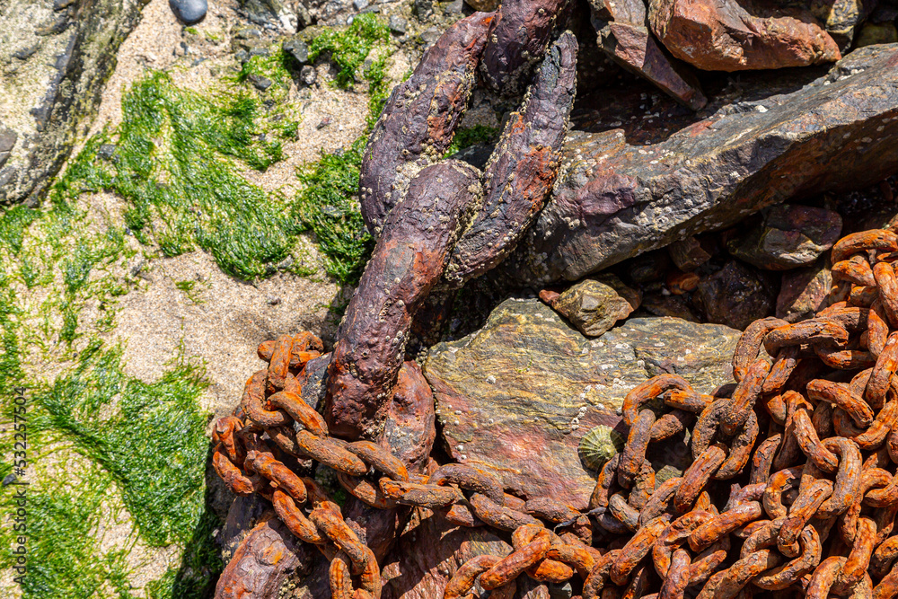 Textured, weathered chains on a beach Textured, weathered chains on a beach